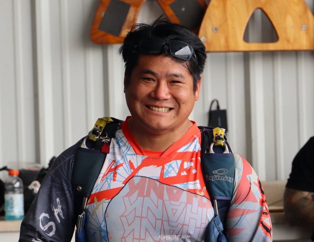 Derrick wearing skydiving gear